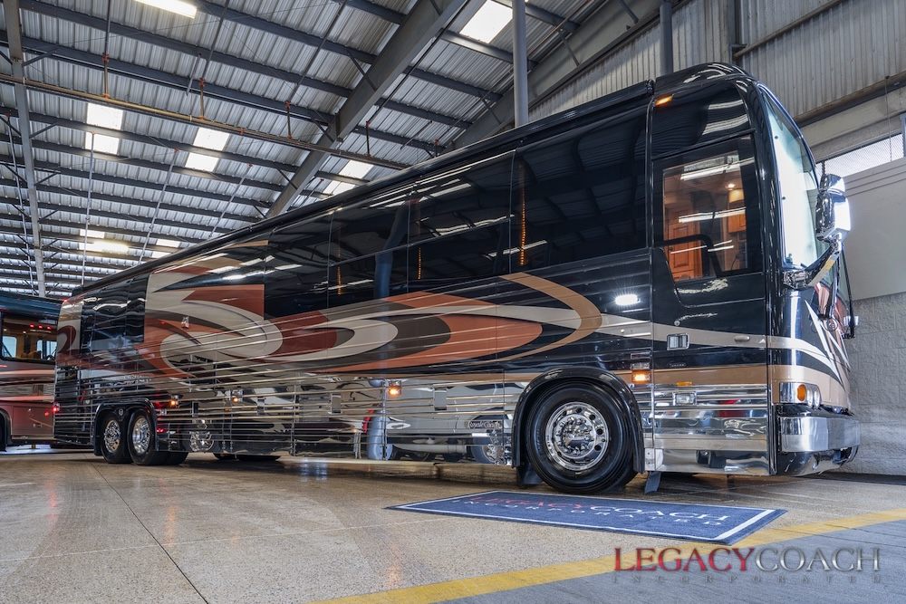 A 2006 Royale Coach XLII motorhome on a Prevost shell, parked indoors